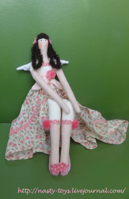 A romantic Tilda angel doll handmade with linen and crocheted flowers.