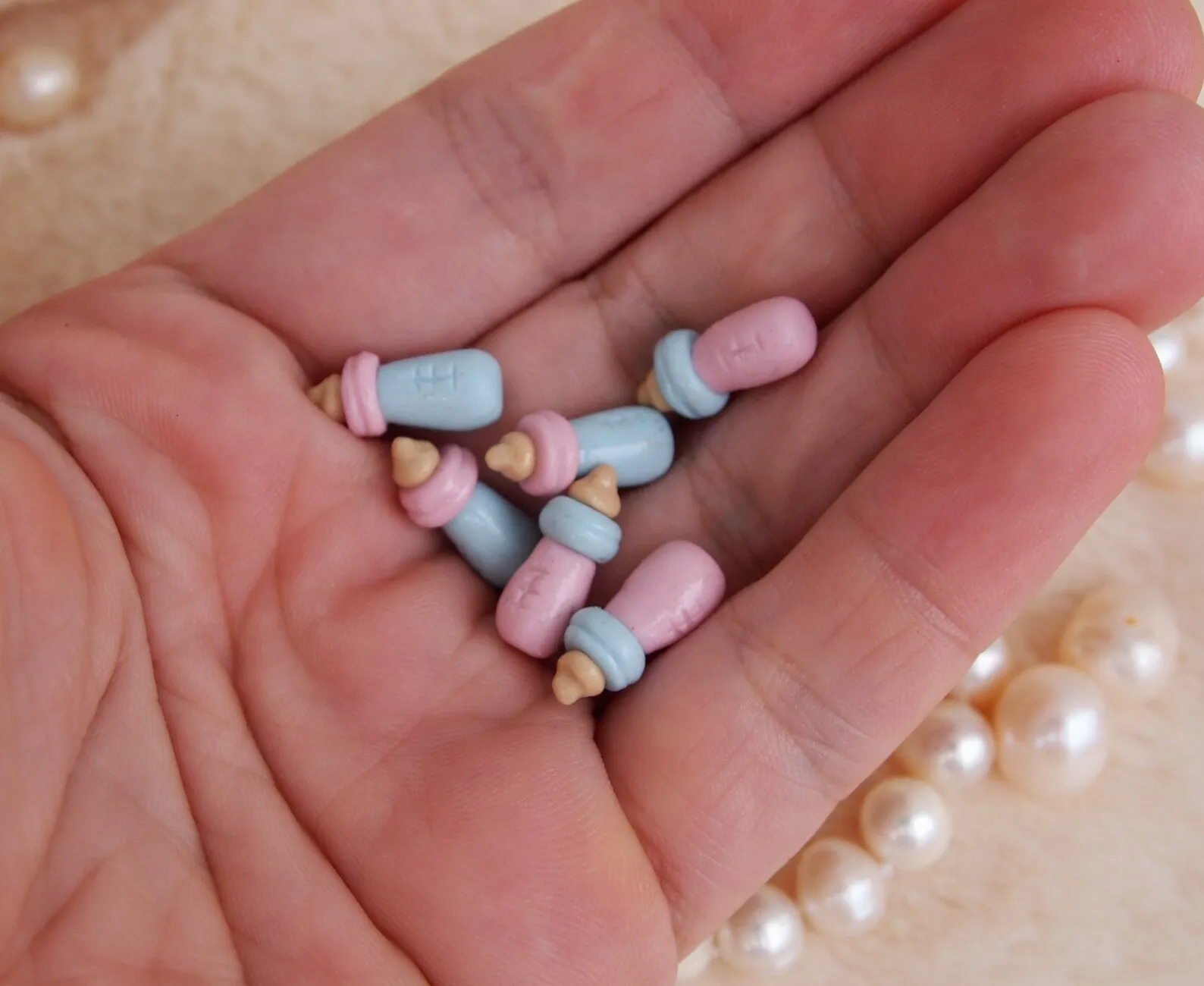 Miniature Baby Bottle: Tiny 1cm hand-sculpted polymer clay baby bottle in pink or blue. Accessory for 1:12 scale micro baby dolls and dollhouses.