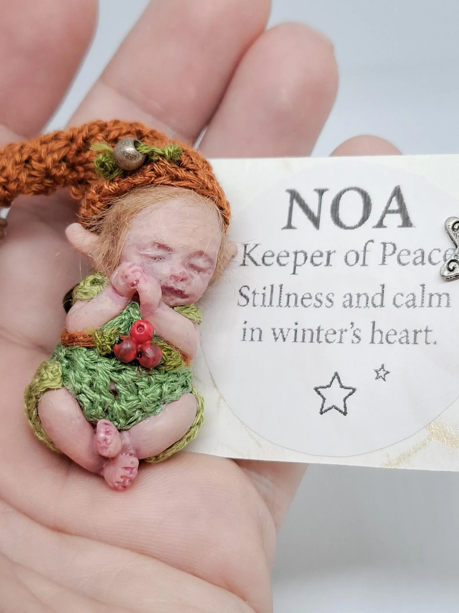 OOAK resin micro art doll Noa, Lightkeeper of Peace. A 1:12 scale miniature collectible featuring a peaceful expression and handcrafted details.