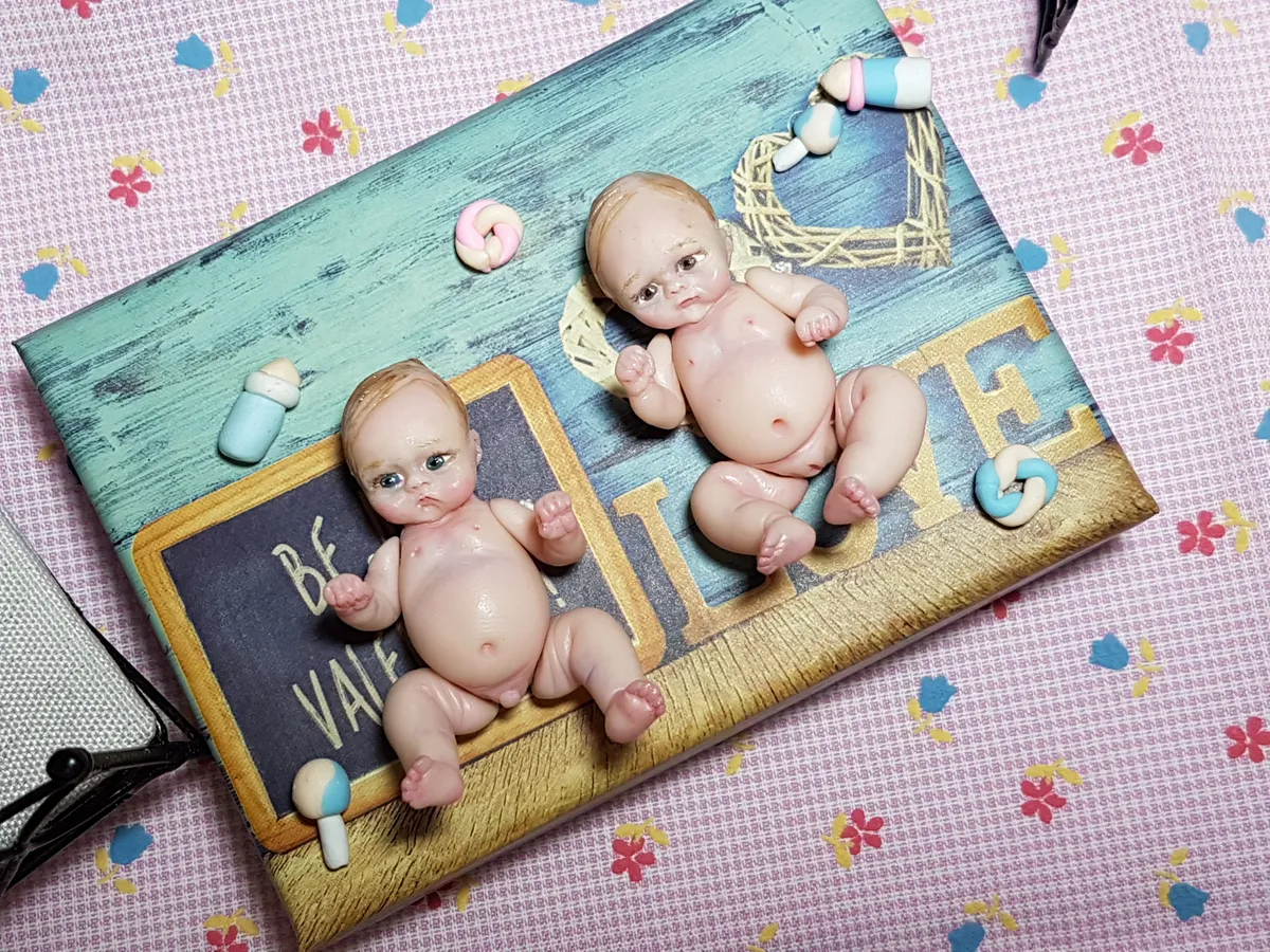 Two OOAK miniature baby dolls posed on decorative 'BE BRAVE' board with school supplies and miniature accessories - by Mini Baby Dolls